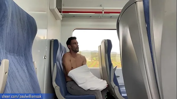 Sexy tanned man travelling naked by train. Very risky public nudity