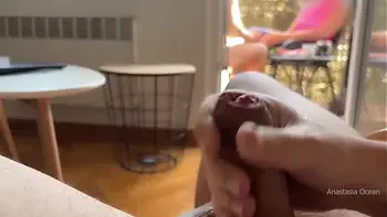 My husband is jerking off and cum in front of my stepmom a while we talk on balcony.