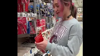 Busty babe flashes her tits all over the home store