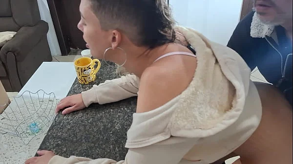 A stepdaughter is surprised while having breakfast.