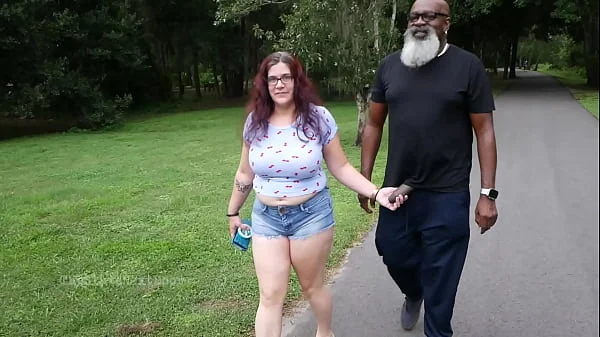 Nerdy Milf strokes and suck blk dick in the Park