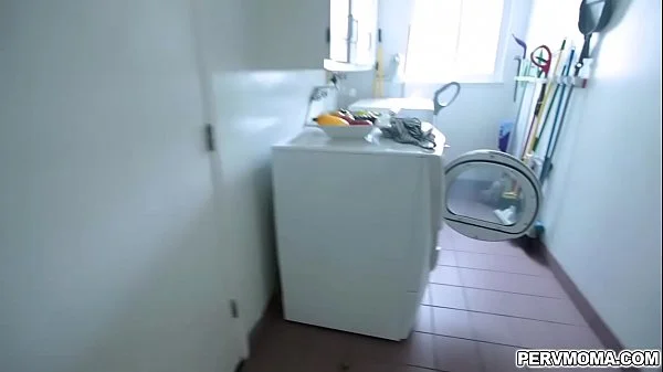 Stepson gets an eyeful as stepmom stands at the sink!