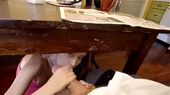 step Daughter sneaks under the table to suck daddy's cock