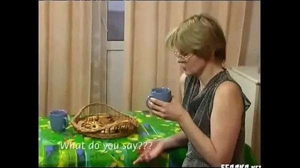 young boy takes tea with mature - M