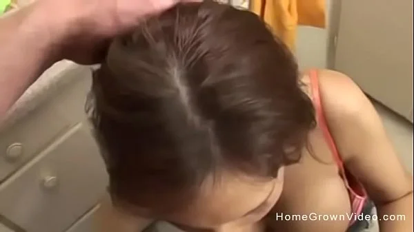 Busty brunette MILF sucking her neighbors big cock