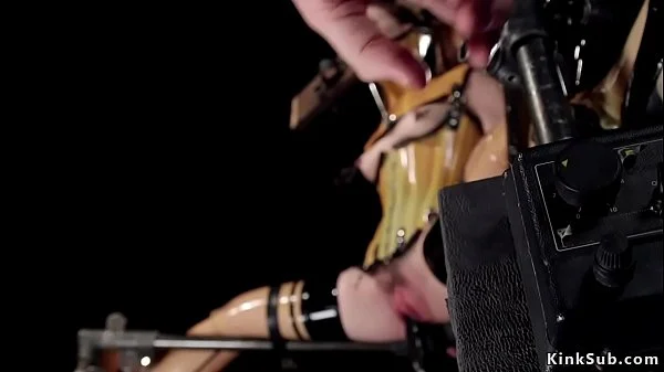 Sub in plastic corset in device bondage
