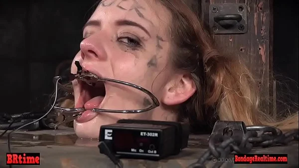 Bdsm babe trapped in a barrel and electrified