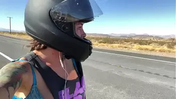 felicity feline riding on aprilia tuono motorcycle