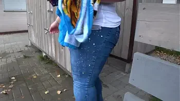 BBW with big booty in tight jeans is dressing in a public dressing room on the beach. Fetish.