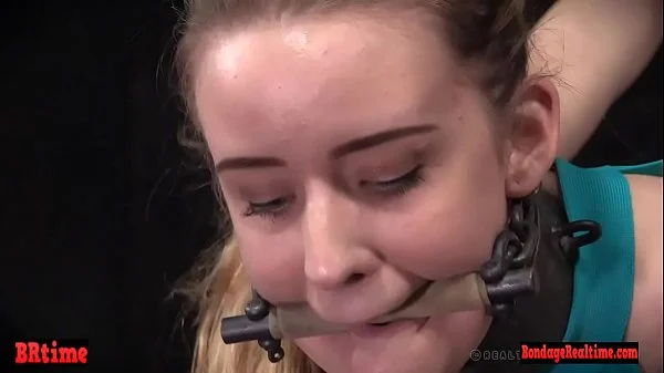 Gagged drooling brunette is dominated