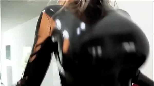 Blonde in rubber suit bouncing boobs
