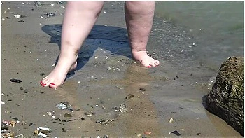 Fat Bare Legs With Red Pedicure Walk Along The Bank Of The River, Fetish