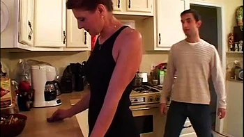 Mature redhead pounded in the kitchen