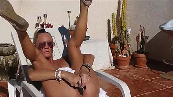 Blonde MILF in Bohemian Skirt No Panties Fucks Dildo Hard & Cums on Sun Bed