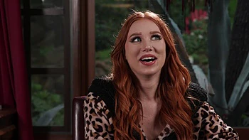 The red head Madison Morgan shows her assets in a captivating video