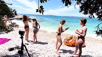 Two hot lesbians Rebeka Ruby and Miss Pussycat are having fun on the beach.