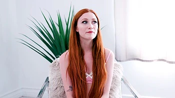 Redhead Scarlet Skies enjoys intimate moments with her partner.