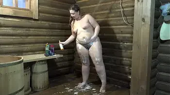 Mature BBW with a beautiful ass in the shower fucks her hairy pussy with a big bottle of shampoo and shows her gaping hole Home fetish