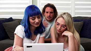 Two hot girls share a big cock in an intense threesome scene