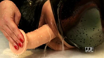 Bartroom dildoing in latex