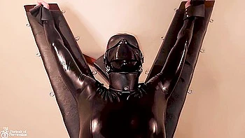 Latex Servitude Floozy Is Made To Have Multiple Orgasms On A Cross