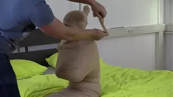 Blue haired Teen girl put in mummification