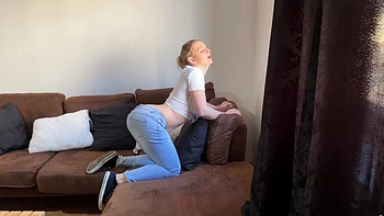 Amateur blonde Kristy Water masturbates on the sofa, showcasing her solo skills.