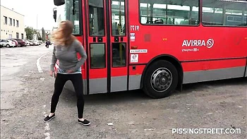 Crazy solo pissing on the pave with a hot short-haired girlfriend Suzie