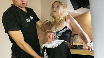 The couple has a hot sex in the kitchen while the maid is busy with a Lolipop.